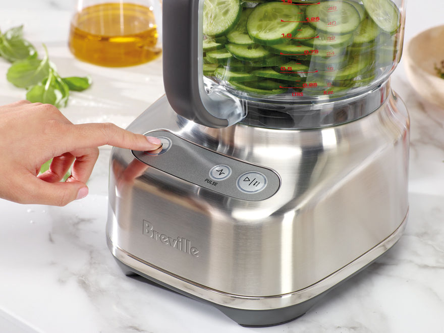 Cucumber slices in the food processor bowl